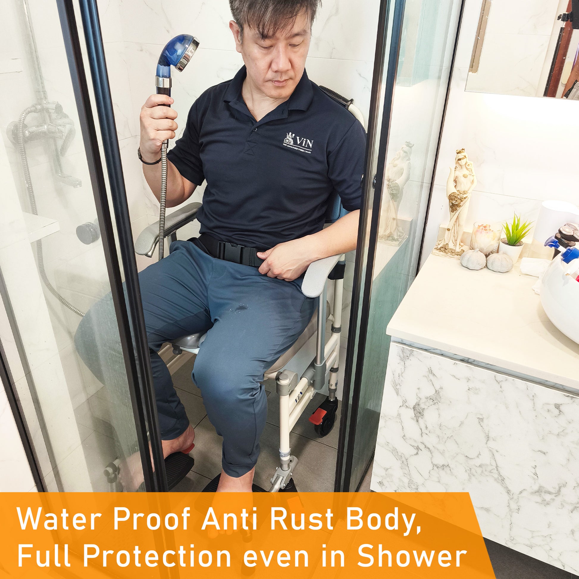 ViN-K05 foldable aluminum shower commode chair with waterproof cushion, adjustable armrests, flip-in footrests, full-lock caster wheels, removable commode bucket, anti-tipper, safety belt, and detachable backrest for toilet, shower, and indoor wheelchair use.